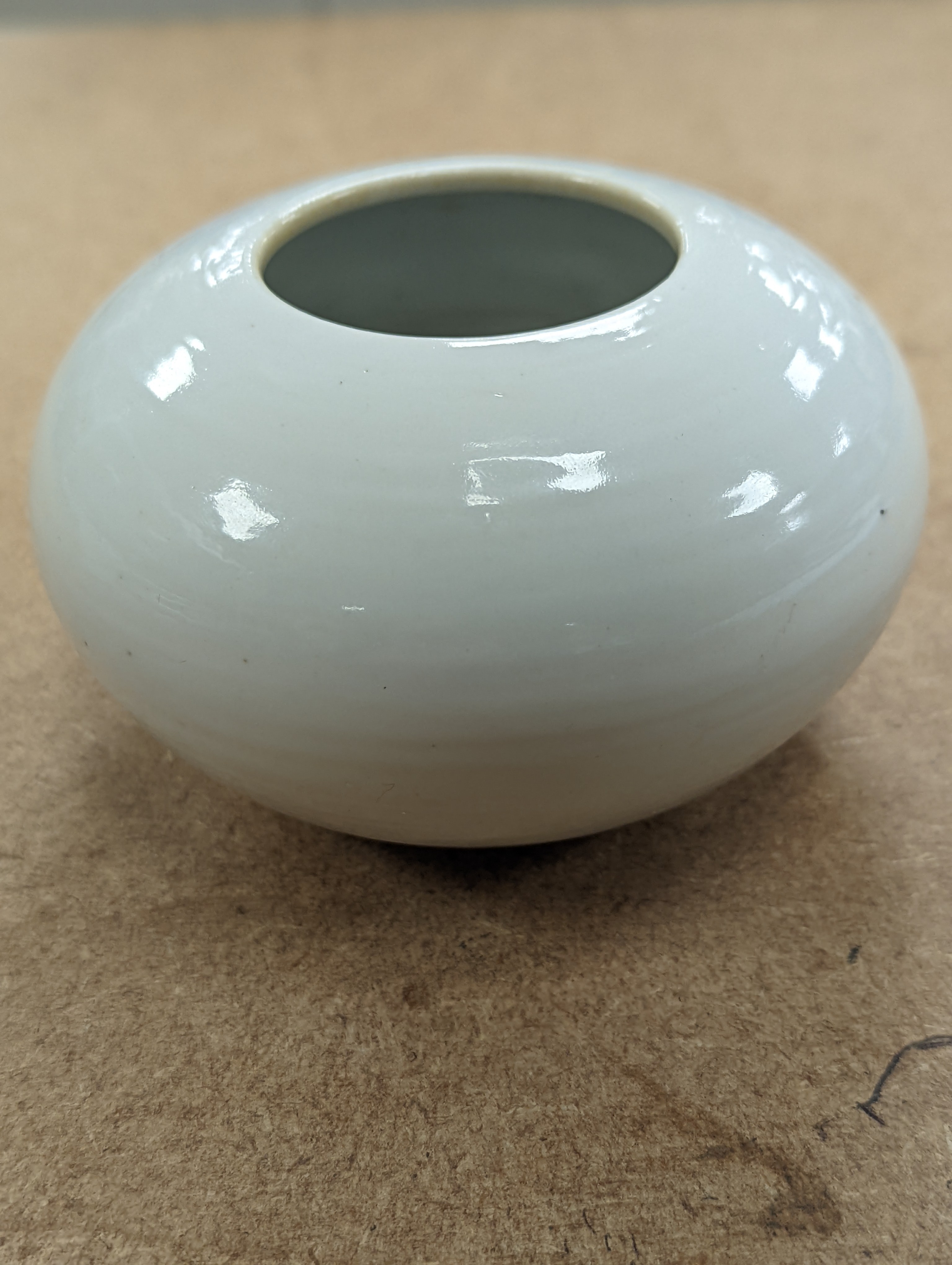A Chinese white glazed water pot and a similar cup (2)